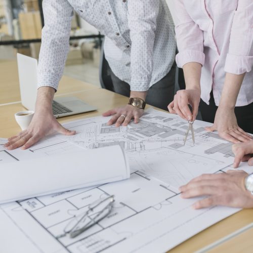 business-people-looking-plans-office business-people-looking-plans-office